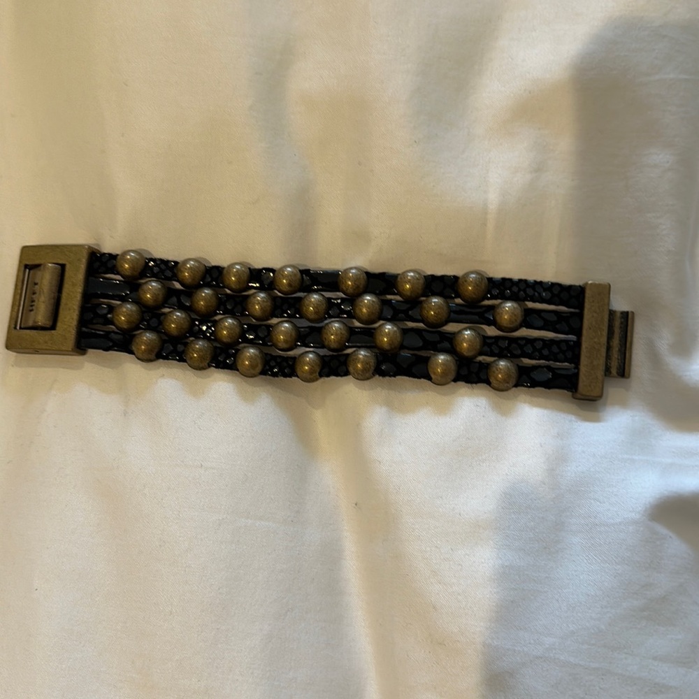 Heet black leather strap bracelet with gold/bronze beads.
